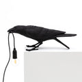 LED-bordlampe Bird Lamp spielende fugl svart kunstharz forfra