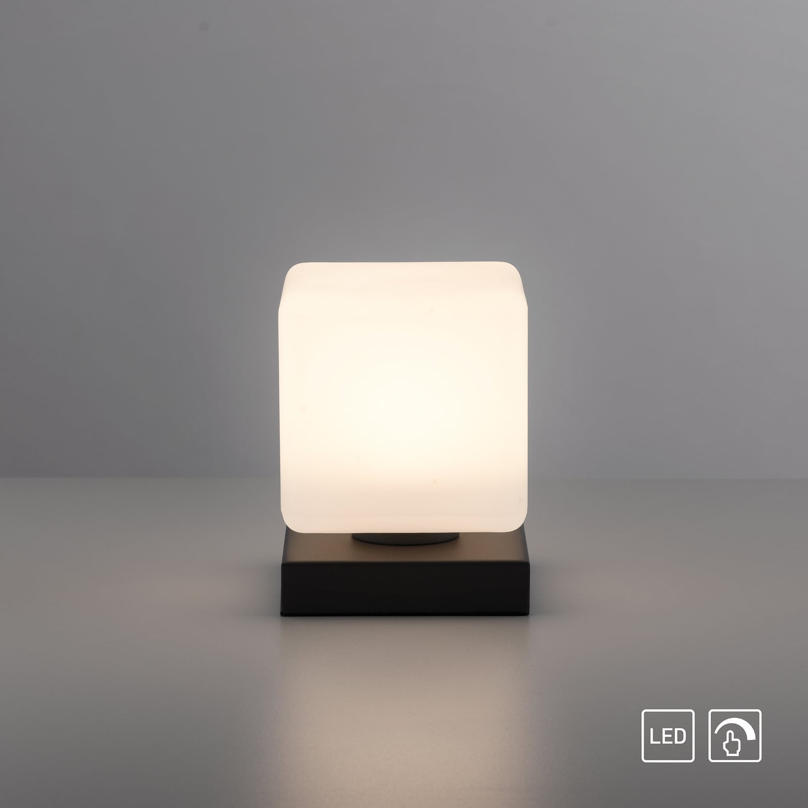 LED bordlampe Dadoa glass antrasitt dimbar 7W varmhvit med lys på