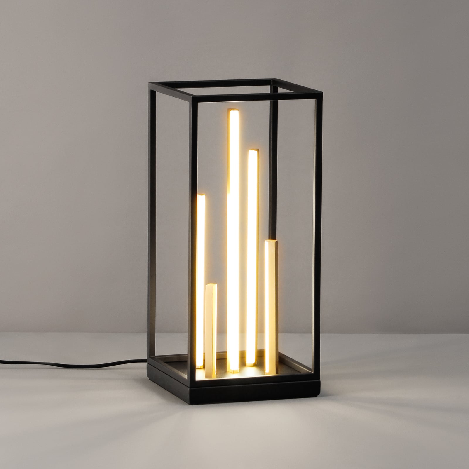 Detalj av LED bordlampe Grid svart/gull metall CCT dimbar