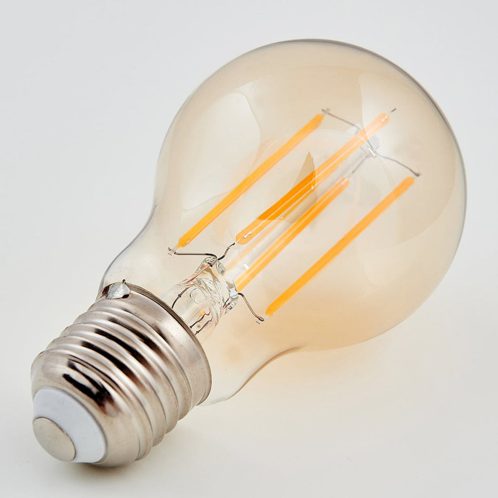 Detalj av LED filamentpære E27 pæreform 6W 1800K amber - Lindby