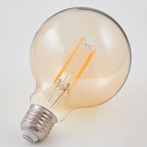 LED filamentpære E27 globe 6W 500lm 1800K amber glass Lindby nærbilde