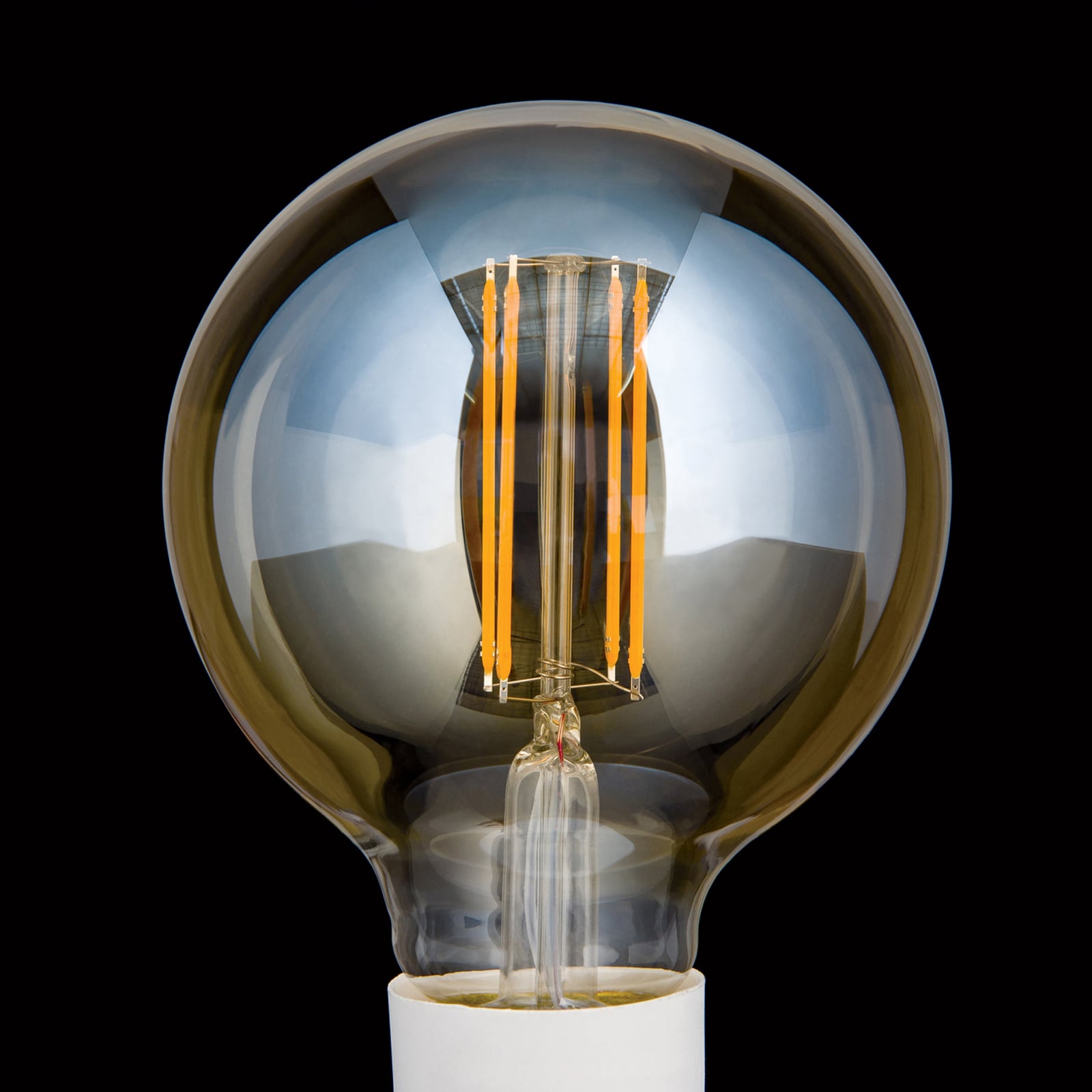 Detalj av LED globepære E27 G95 6W 2200K dimbar amber glass - ORION