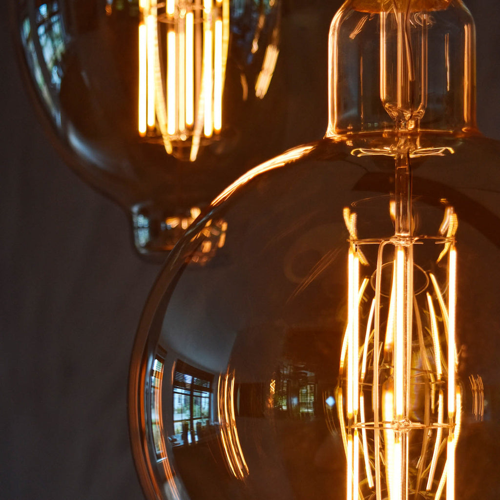 LED globepære Megaglobe G200 E27 10,5W 1100lm dimbar gull emballasje