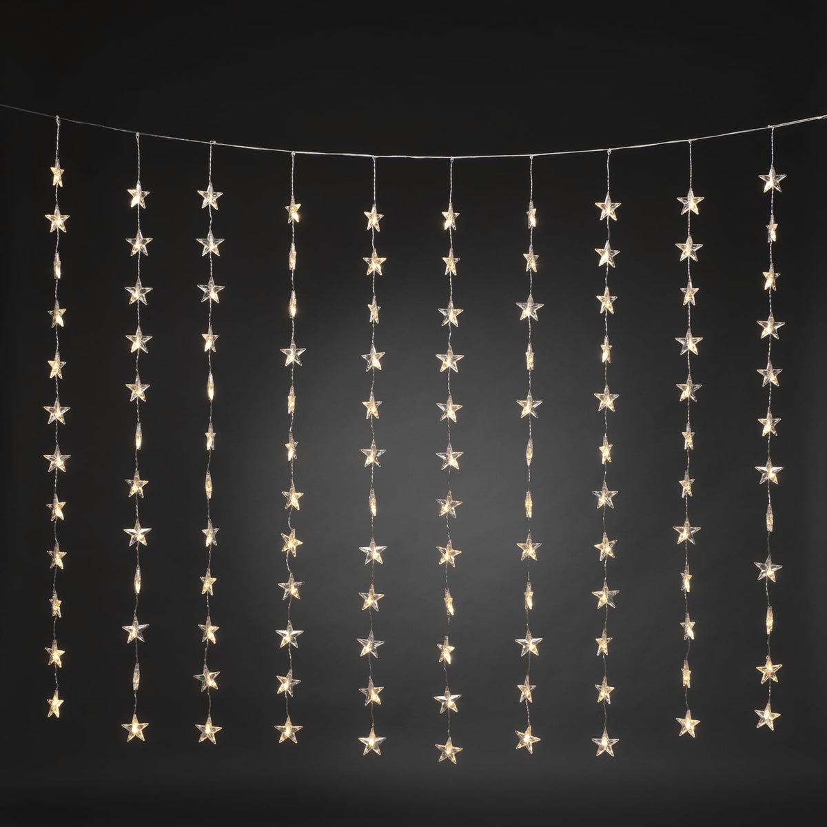 Nærbilde av LED-lys i LED-lysgardin stjerner 120 lys varmhvit 140x120 cm