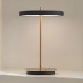 LED oppladbar bordlampe Asteria Move svart/messing Ø20 cm forfra