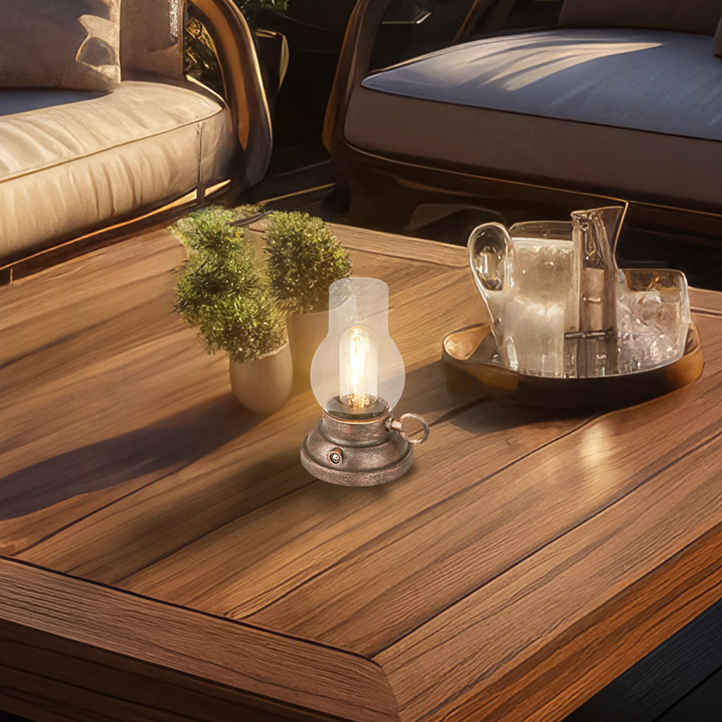LED oppladbar bordlampe Kanea dimbar bronse glass IP44 montert på terrasse