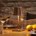 LED oppladbar bordlampe Nuindie mini bronse dimbar IP54 foran