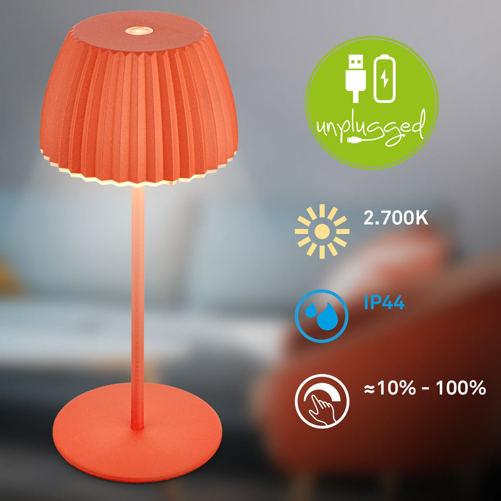 LED oppladbar bordlampe Riffle dimbar oransje IP44 i bruk utendørs