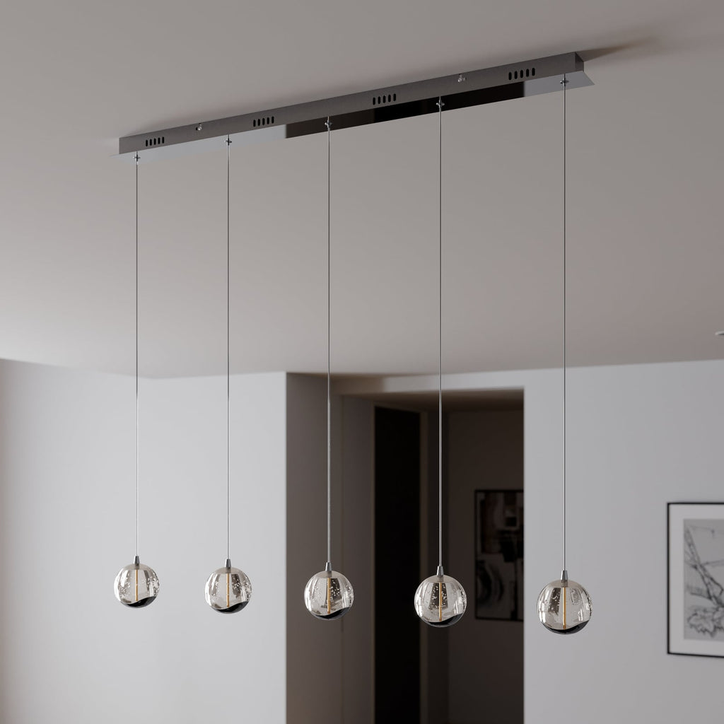 LED pendellampe Hayley 5-lys glass krom 96 cm montert over spisebord