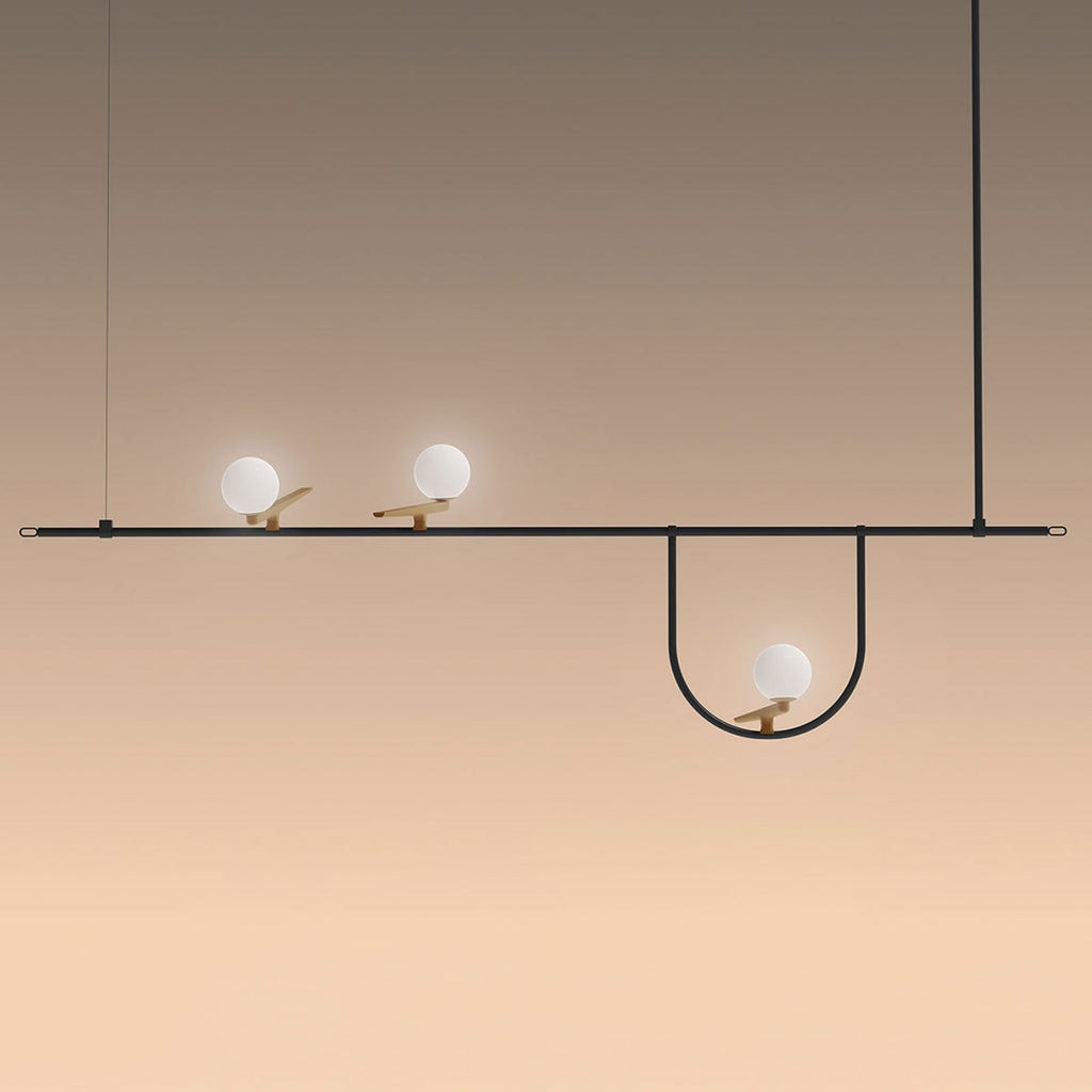 LED pendellampe Yanzi 1 3-lys messing/svart montert i rom