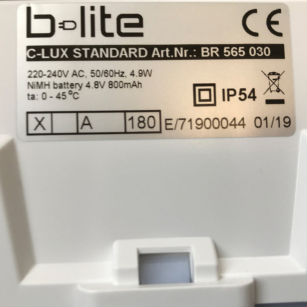 Montert LED rømningsskilt C-Lux Standard sentralforsyning IP54 i bygg