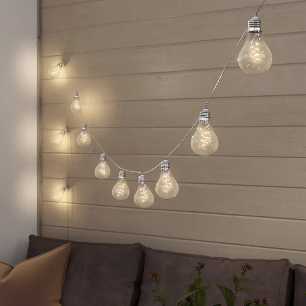 LED solcelle-lyslenke Lampini montert i hage