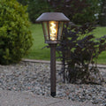 LED solcellestolpelampe Fergus lanterneform brun IP44 forfra