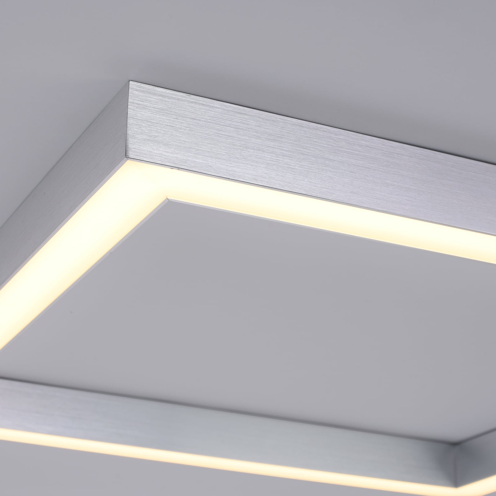 Nærbilde av fjernkontroll til LED taklampe PURE Lines Square