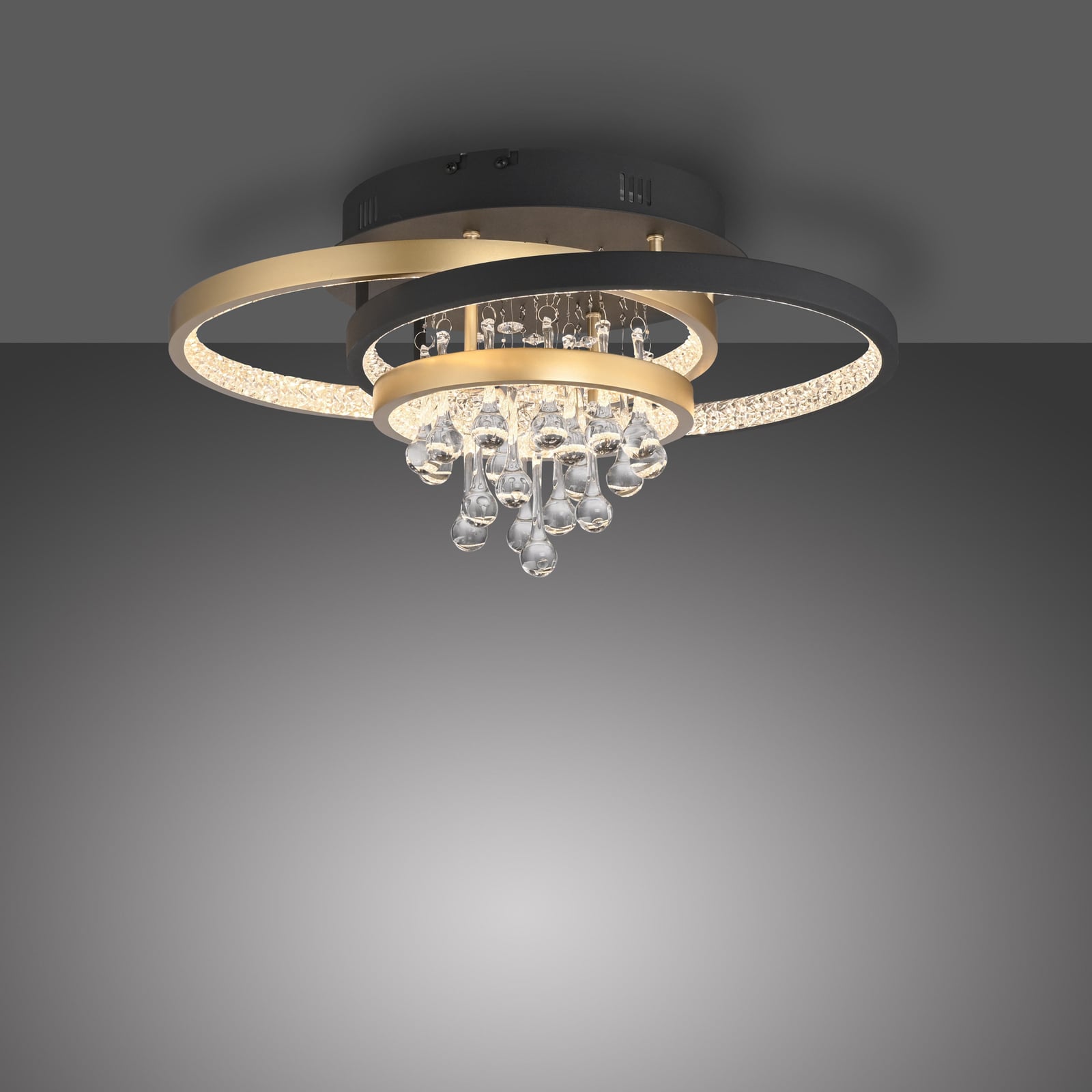 LED taklampe Rotazo krystall CCT dimbar svart/messing montert i rom