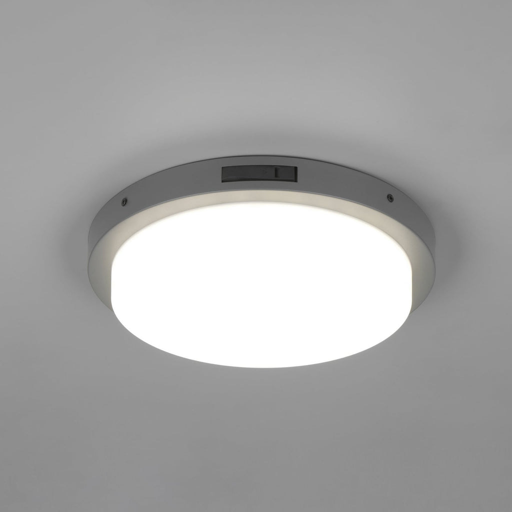 LED utevegglampe Bermejo rund CCT med bevegelsessensor IP54 montert på vegg