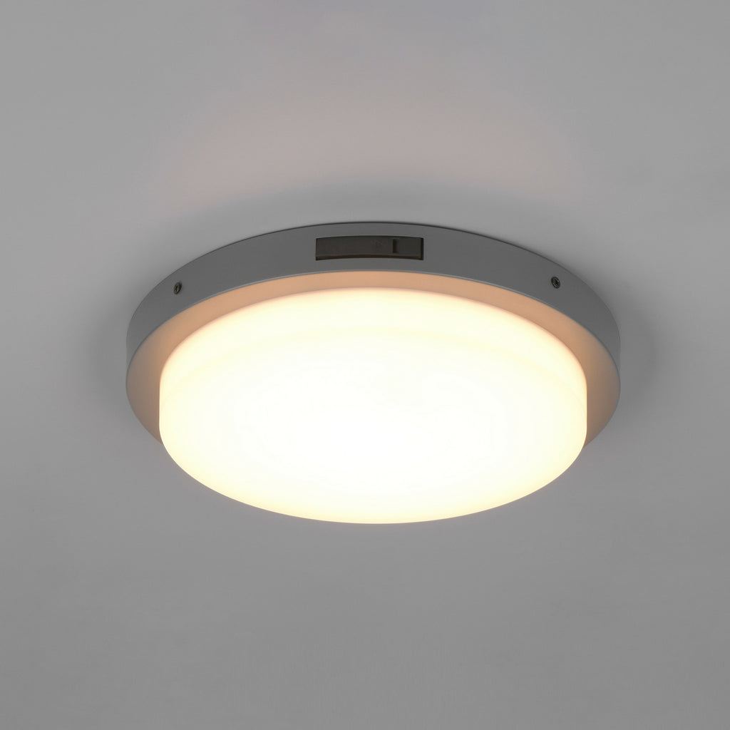 Nærbilde av bevegelsessensor på LED utevegglampe Bermejo rund CCT med bevegelsessensor IP54