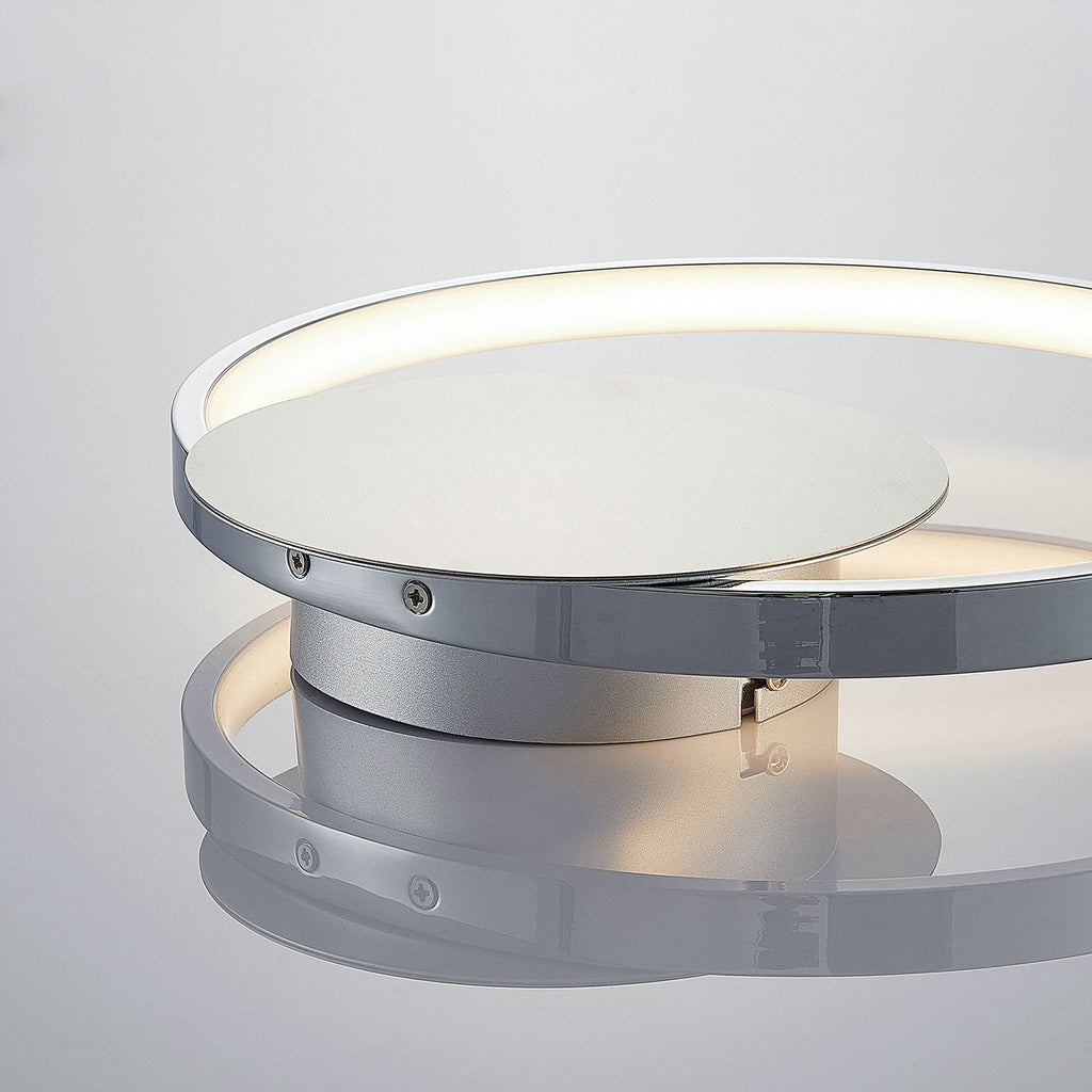 LED vegglampe Anays rund plast krom/klar detalj av lampeoverflate