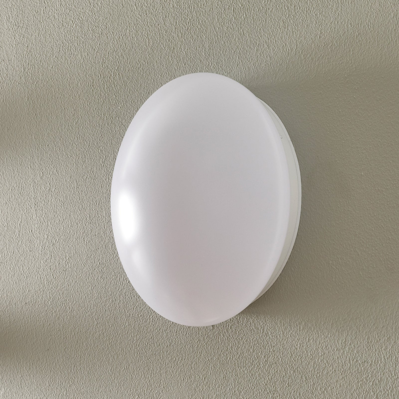 Bakside av LED vegglampe Renzo+ rund i hvitt plastmateriale