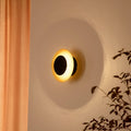 LED vegglampe Tiama rund jern svart/gull forfra