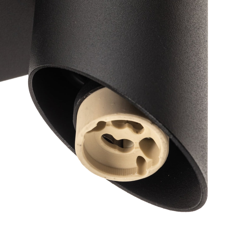 Belysningseffekt fra vegglampe Eye Cut svart stål